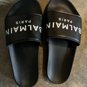 Balmain black slides.